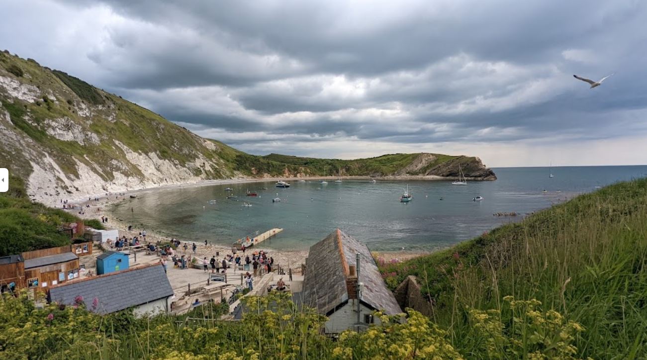 Dorset Tours guests at Durdle Door, another stop on a coastal day including Lulworth Cove